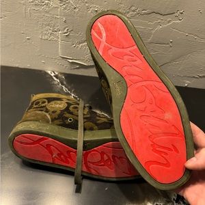 Christian Louboutin high tops with skull pattern.